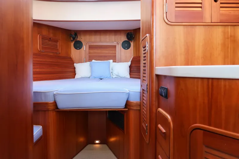 Slide: The Image of Interior of 2005 Hinckley Talaria 40 yacht with wood finish and compact kitchen area. - 28