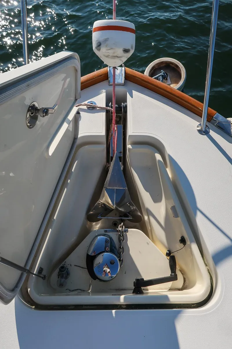 Slide: The Image of Anchor compartment of 2005 Hinckley Talaria 40 boat with open hatch. - 38