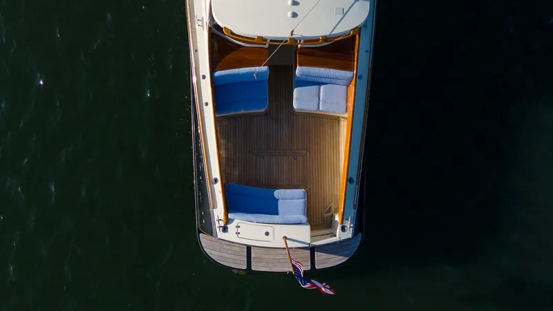 Slide: The Image of 2005 Hinckley Talaria 40 yacht on calm water, showcasing elegant design and craftsmanship. - 5