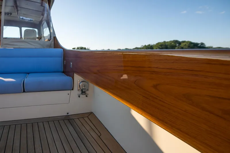 Slide: The Image of Aerial view of 2005 Hinckley Talaria 40 boat with wooden deck and seating. - 8