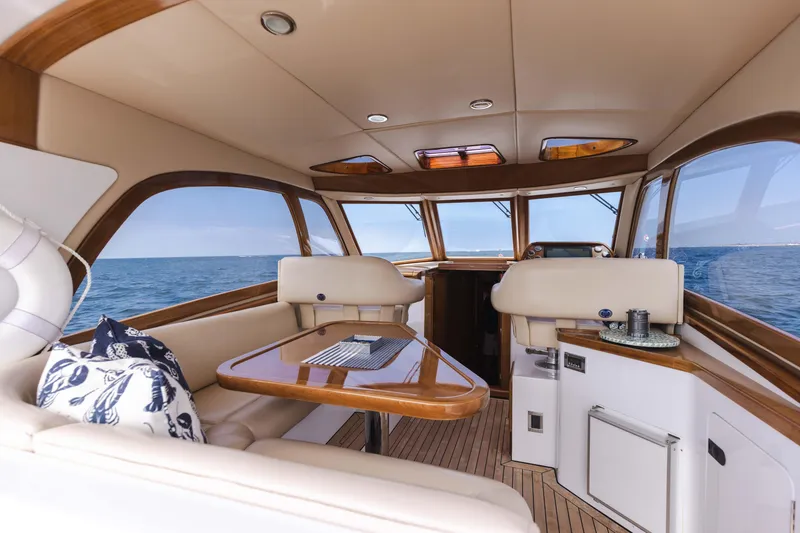 Slide: The Image of Interior of 2014 San Juan Open Express Cruiser with ocean view and luxurious seating. - 10