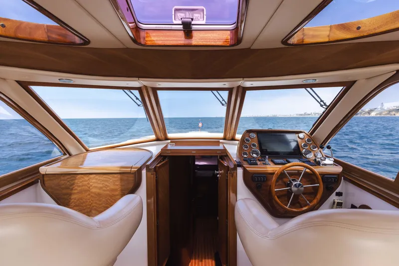 Slide: The Image of Interior of 2014 San Juan Open Express Cruiser with ocean view through windshield. - 11