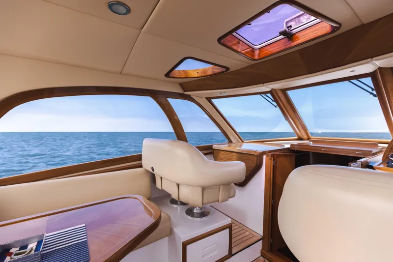 Slide: The Image of Interior of 2014 San Juan Open Express Cruiser with ocean view through windows. - 2