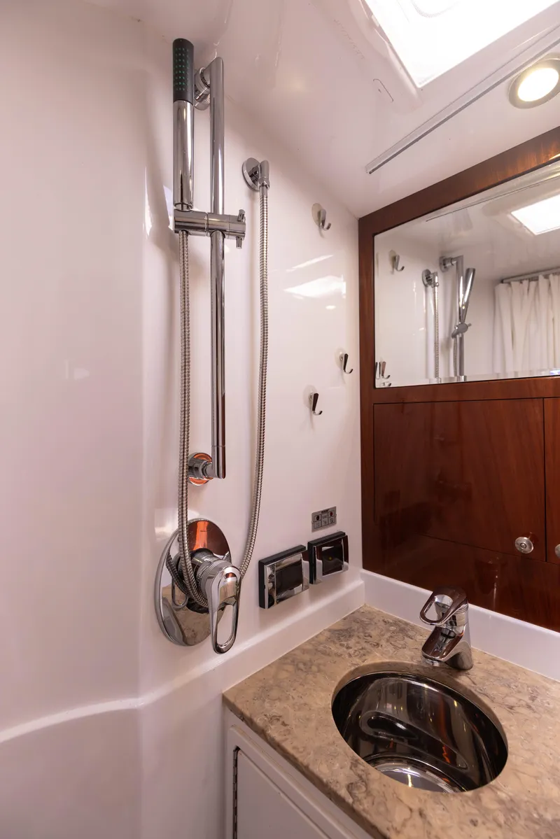 Slide: The Image of 2014 San Juan Open Express Cruiser bathroom with shower and sink - 23