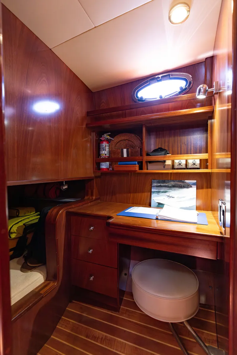 Slide: The Image of Luxurious wooden cabin interior of 2014 San Juan Open Express Cruiser with desk and laptop. - 28