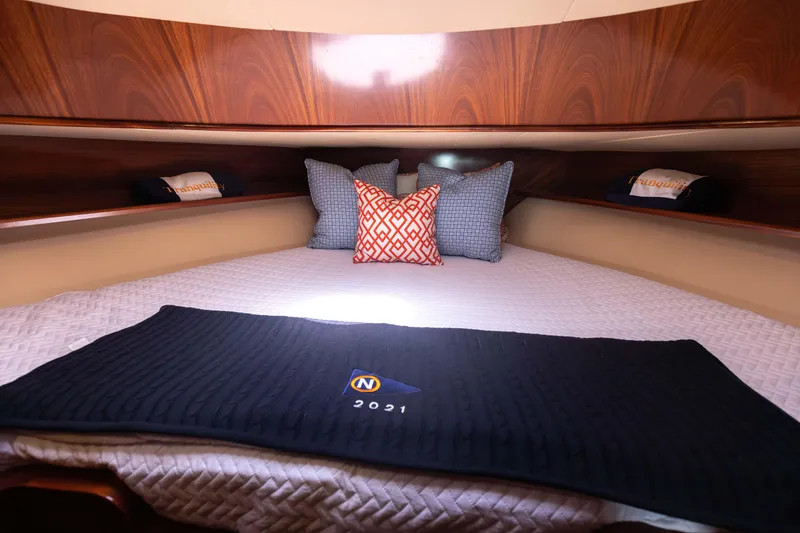 Slide: The Image of Luxurious cabin interior of 2014 San Juan Open Express Cruiser with cozy bedding and decorative pillows. - 30
