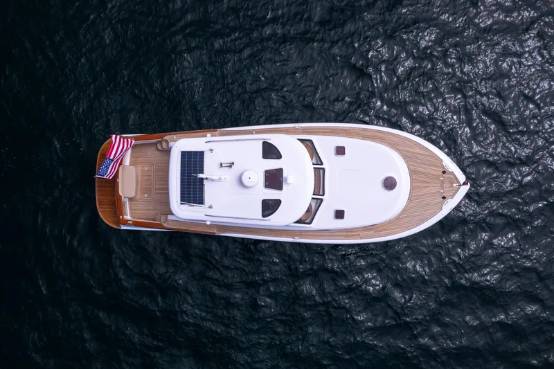 Slide: The Image of Top view of 2014 San Juan Open Express Cruiser on water. - 36