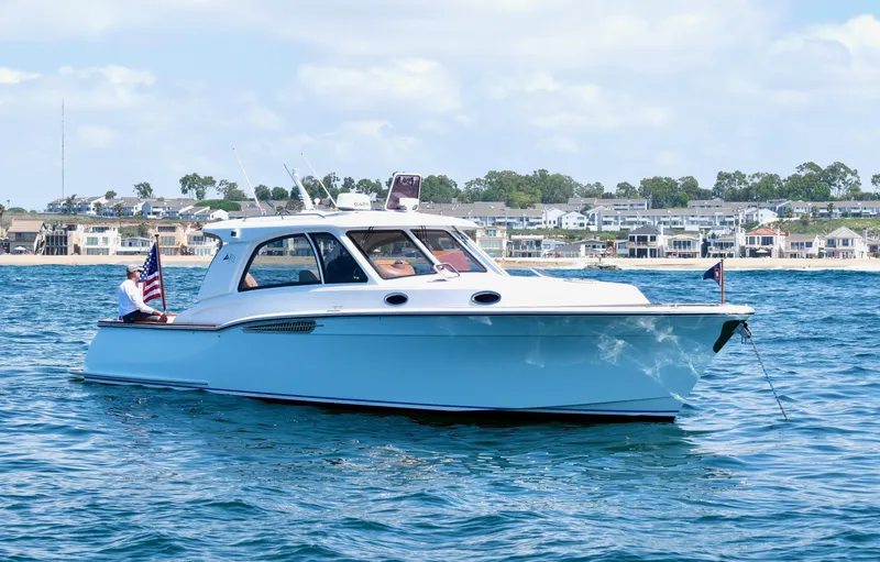 Slide: The Image of 2014 San Juan Open Express Cruiser on calm waters. - 45