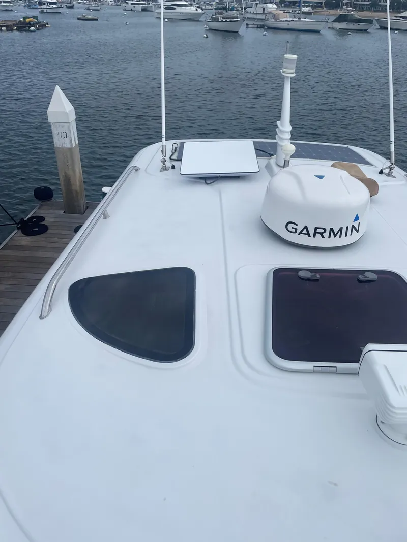 Slide: The Image of 2014 San Juan Open Express Cruiser docked with Garmin equipment. - 47