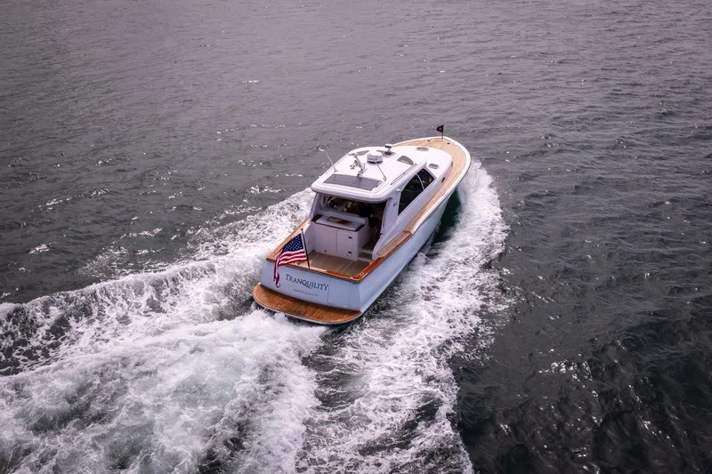 Slide: The Image of 2014 San Juan Open Express Cruiser on the water, rear view. - 51