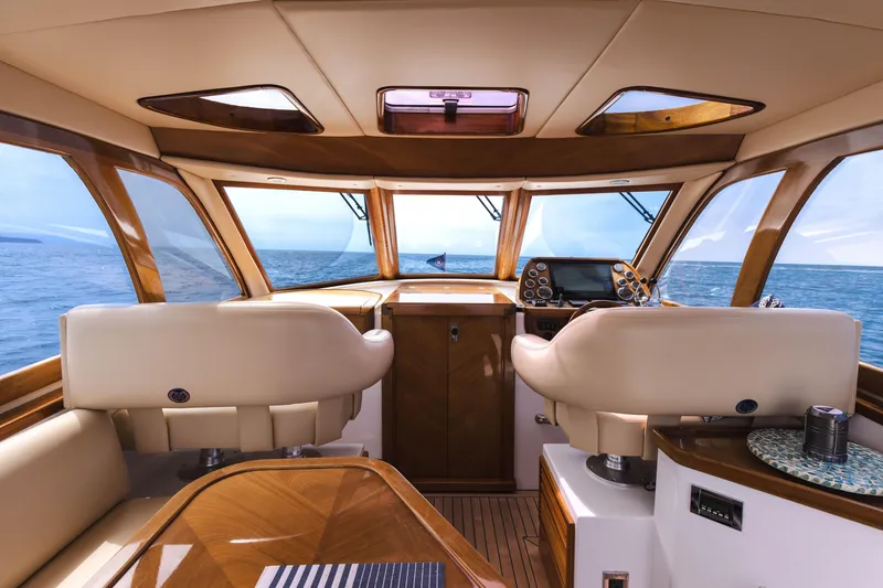 Slide: The Image of Interior of 2014 San Juan Open Express Cruiser with ocean view through windows. - 7