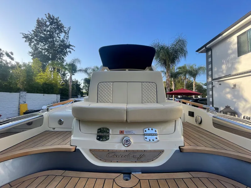 Slide: The Image of 2022 Chris-Craft Launch 25 GT boat with elegant seating and teak deck. - 13