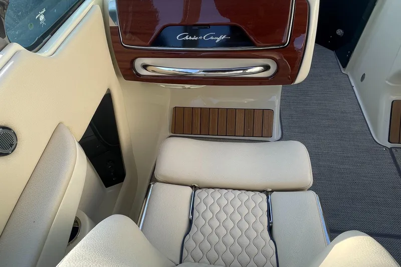 Slide: The Image of 2022 Chris-Craft Launch 25 GT interior with luxurious seating and wood accents. - 6