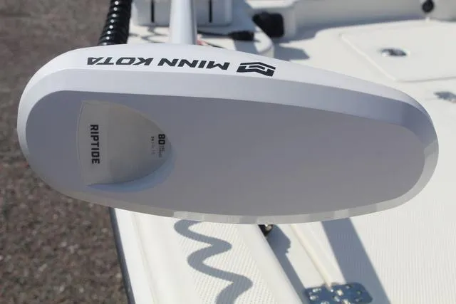 Slide: The Image of 2024 Mako Pro Skiff 19 CC boat interior with seating and console. - 12