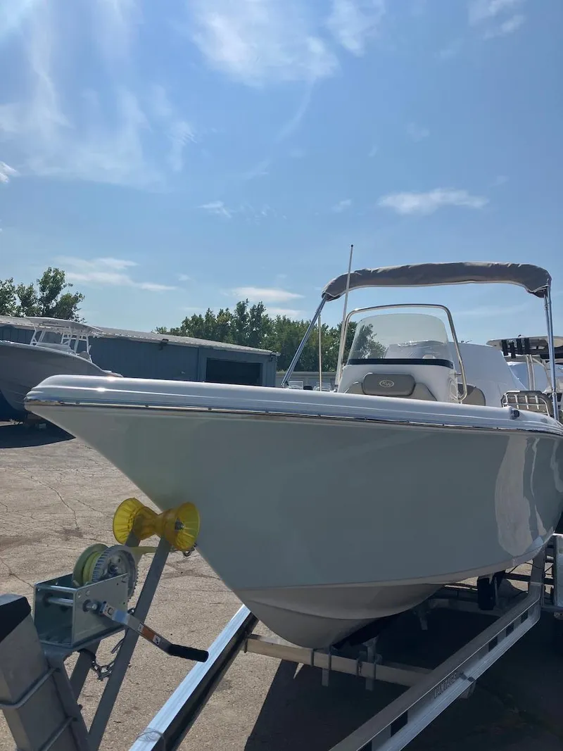 Slide: The Image of 2024 Key West 203 FS boat on trailer under clear sky. - 5