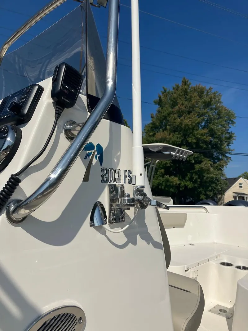 Slide: The Image of 2024 Key West 203 FS boat console with controls and steering wheel. - 8