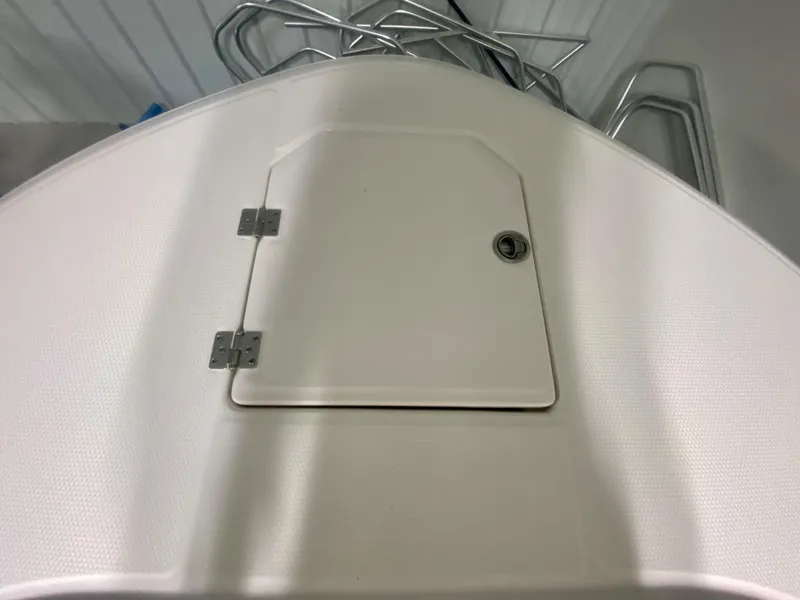 Slide: The Image of 2024 Robalo R270 boat deck hatch with stainless steel hardware. - 34