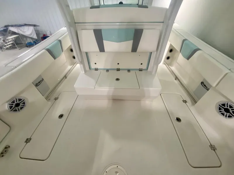 Slide: The Image of 2024 Robalo R270 boat interior with seating and storage compartments. - 11
