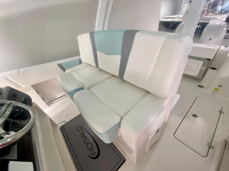 Slide: The Image of 2024 Robalo R270 boat interior seating and helm station. - 18