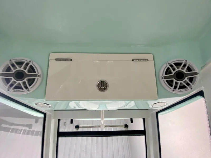 Slide: The Image of 2024 Robalo R270 boat interior with speakers and storage compartment. - 28
