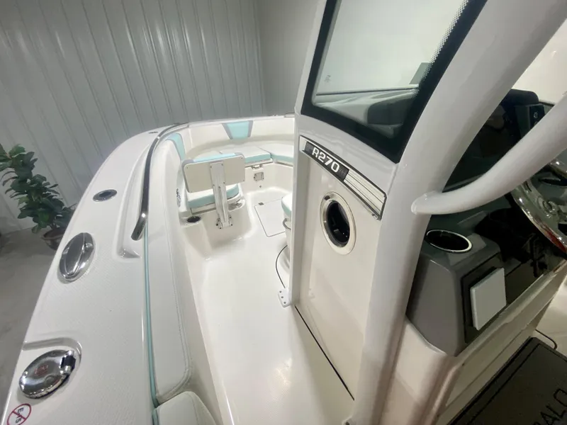 Slide: The Image of 2024 Robalo R270 boat interior with modern design and sleek dashboard. - 31