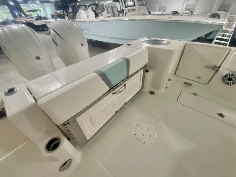 Slide: The Image of 2024 Robalo R270 boat interior with seating and storage compartments. - 8