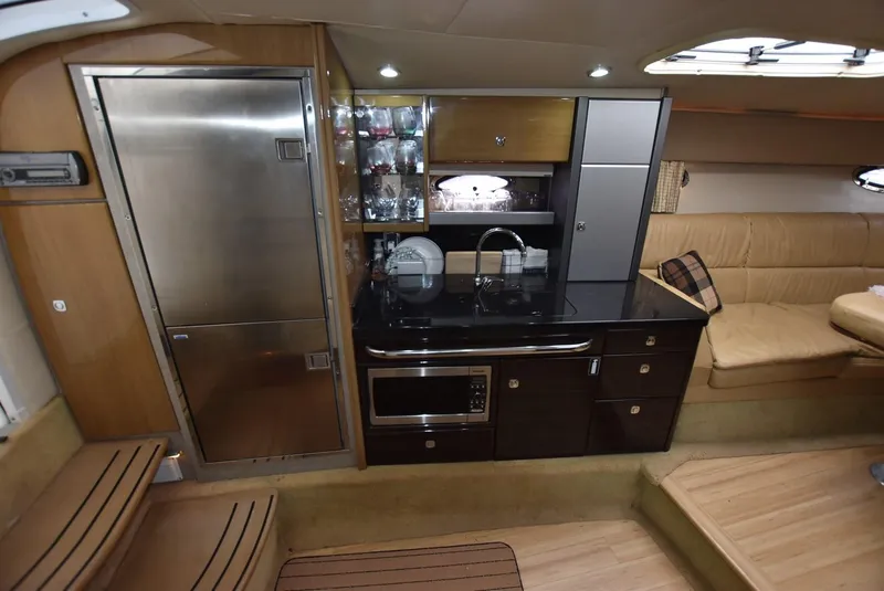 Slide: The Image of 2011 Formula 400ss yacht interior with modern kitchen and seating area. - 17