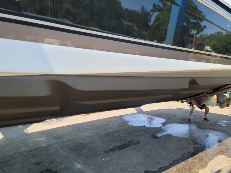 Slide: The Image of 2011 Formula 400ss boat hull being cleaned on dry dock. - 23
