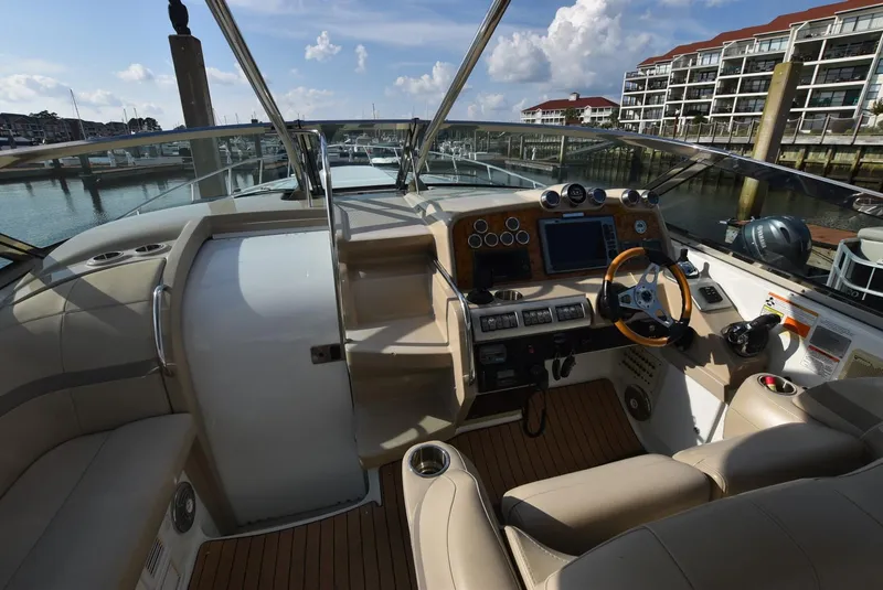 Slide: The Image of 2011 Formula 400ss boat cockpit with modern controls and waterfront view. - 7