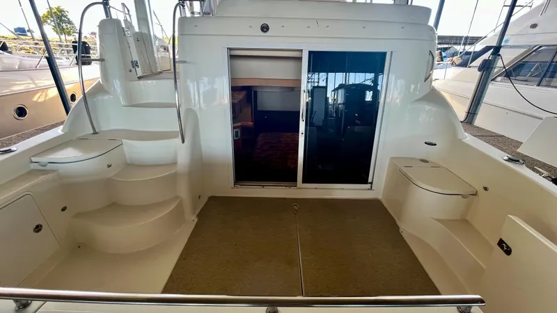 Slide: The Image of 2008 Meridian 459 Motoryacht aft deck with steps and sliding glass doors. - 14