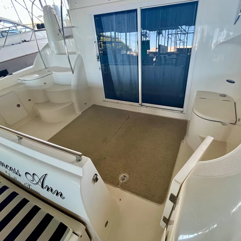 Slide: The Image of 2008 Meridian 459 Motoryacht aft deck with sliding glass doors and seating area. - 15