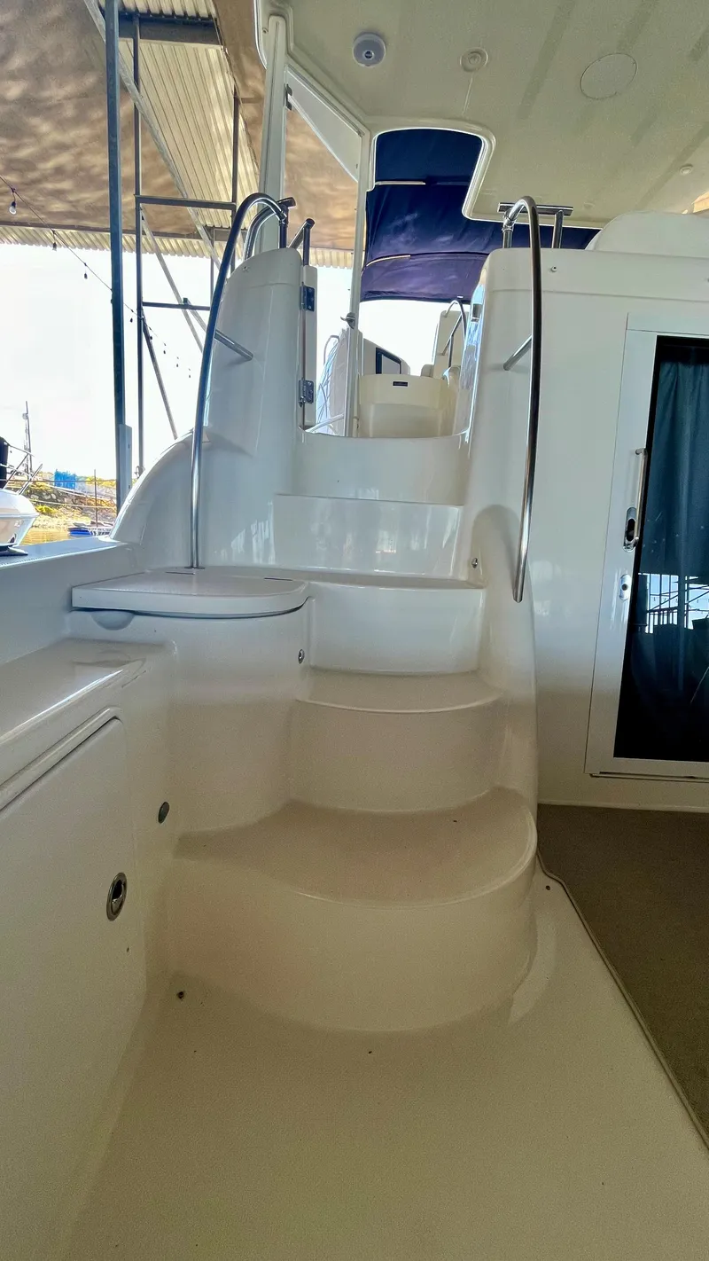 Slide: The Image of Staircase on a 2008 Meridian 459 Motoryacht leading to the upper deck. - 16