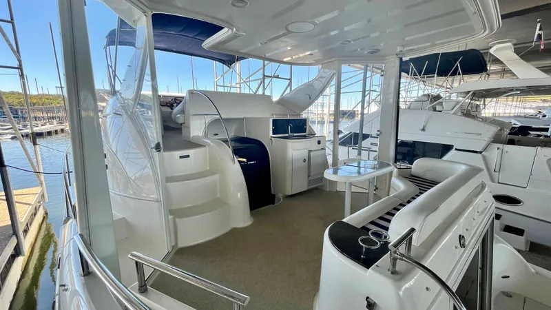 Slide: The Image of 2008 Meridian 459 Motoryacht interior with seating, table, and helm station. - 17