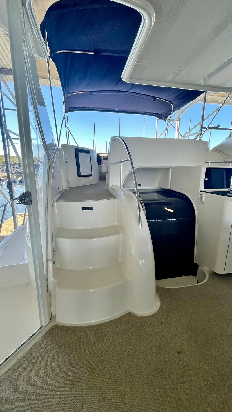 Slide: The Image of 2008 Meridian 459 Motoryacht interior with stairs and blue canopy. - 19