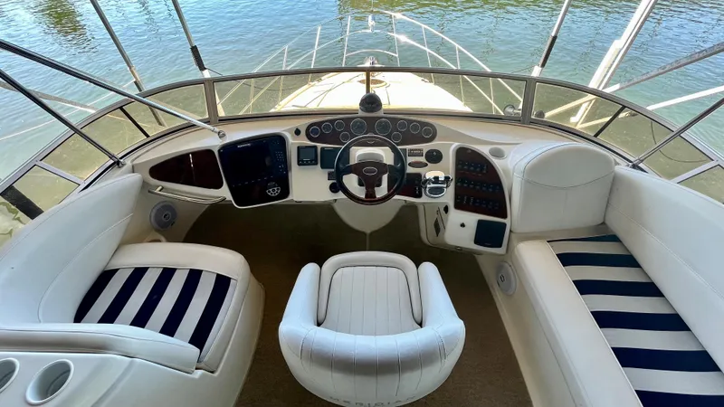 Slide: The Image of 2008 Meridian 459 Motoryacht helm with white and navy seating. - 21