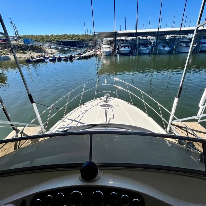 Slide: The Image of View from the helm of a 2008 Meridian 459 Motoryacht docked at a marina. - 24