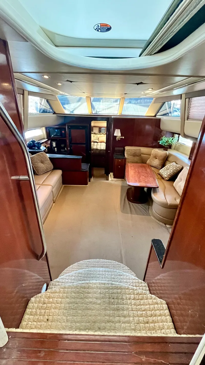 Slide: The Image of Interior of 2008 Meridian 459 Motoryacht with luxurious seating and wooden finishes. - 26