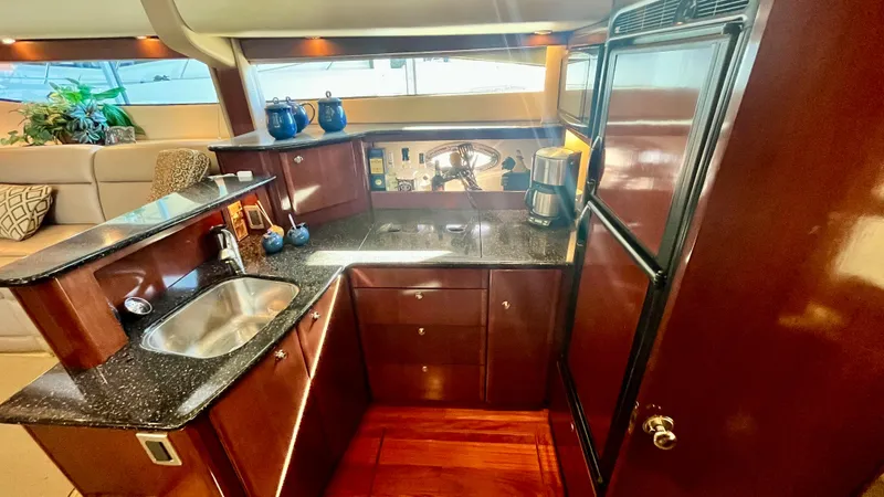 Slide: The Image of 2008 Meridian 459 Motoryacht kitchen with granite countertops and stainless steel sink. - 30