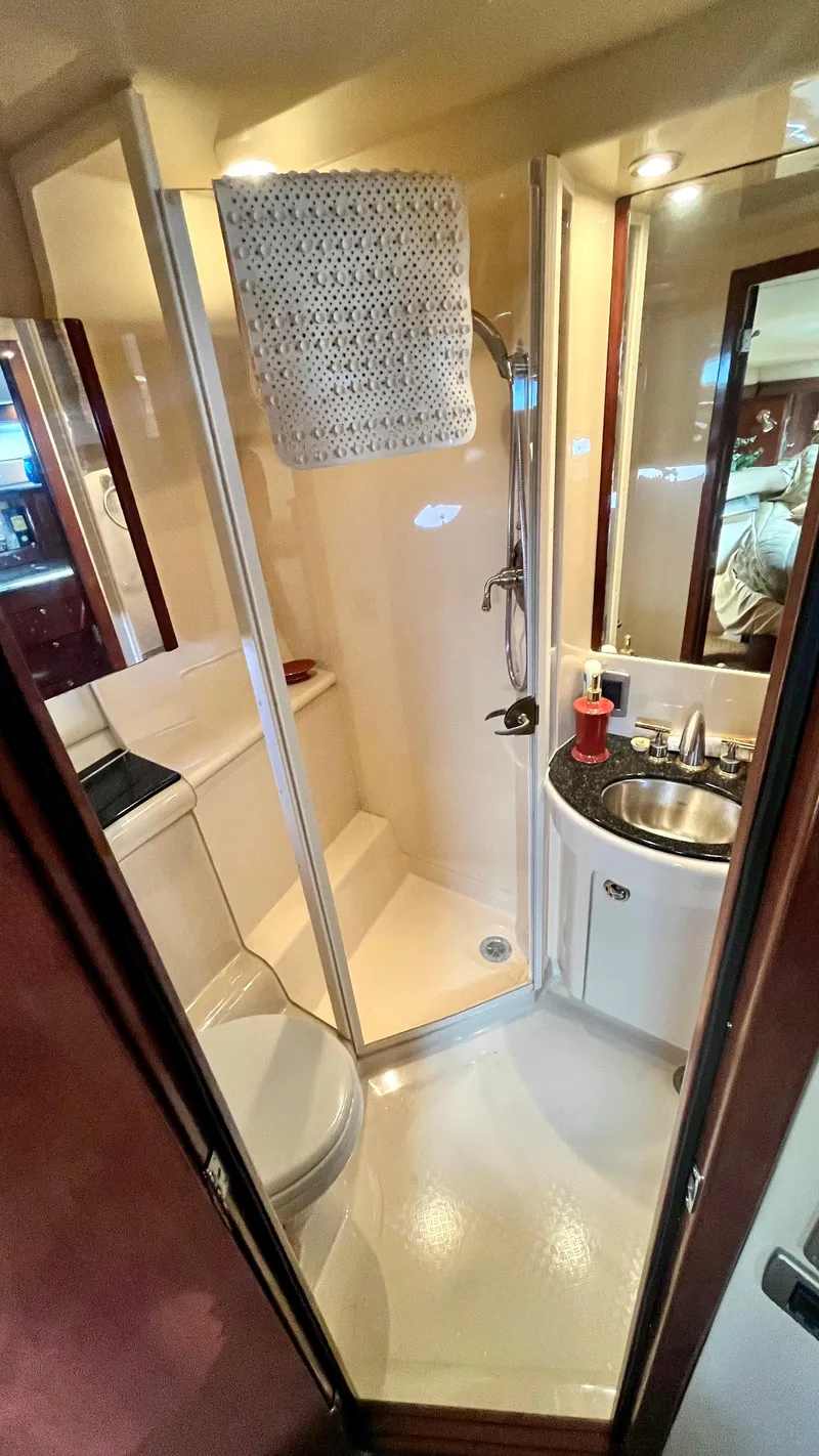 Slide: The Image of 2008 Meridian 459 Motoryacht bathroom with shower, sink, and toilet. - 33
