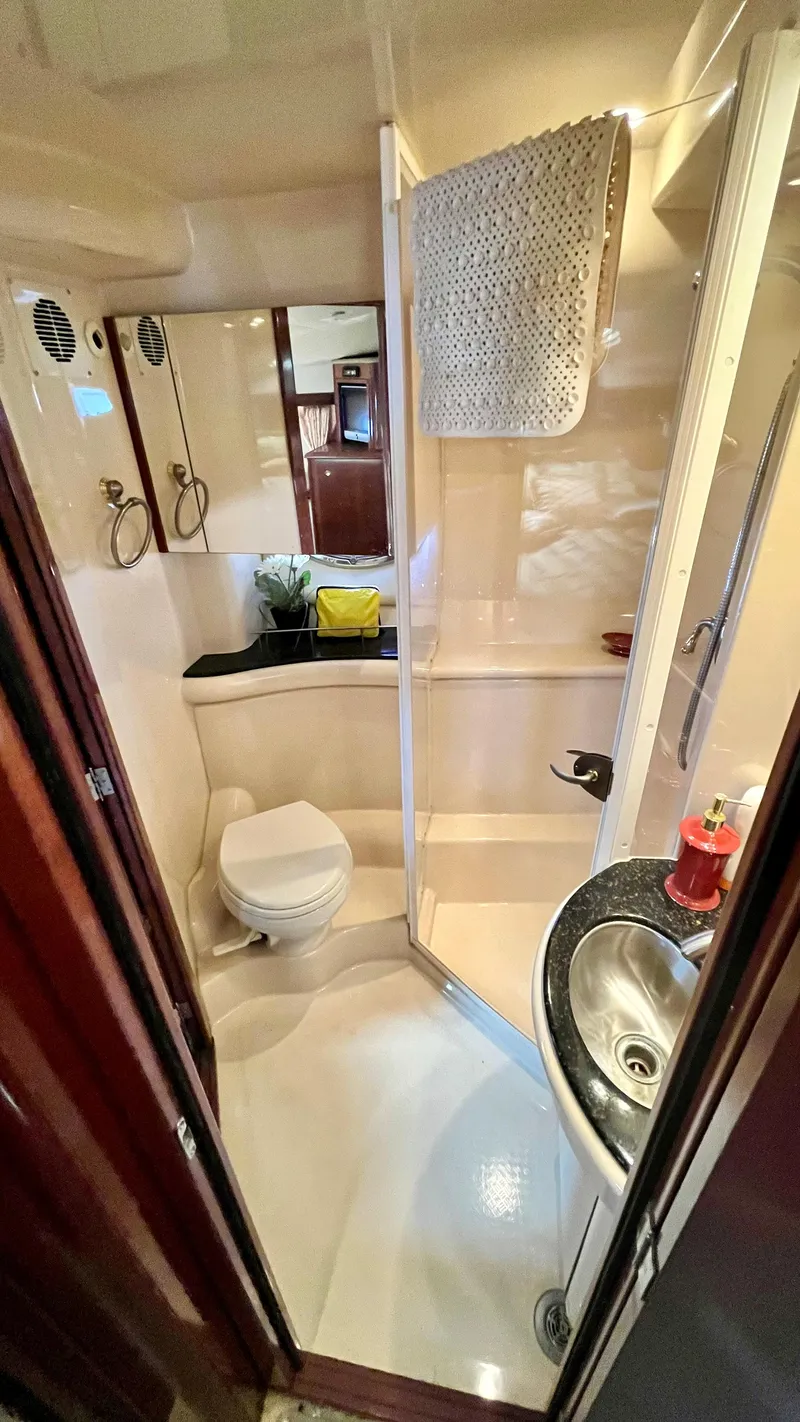 Slide: The Image of 2008 Meridian 459 Motoryacht bathroom with shower, sink, and toilet. - 34