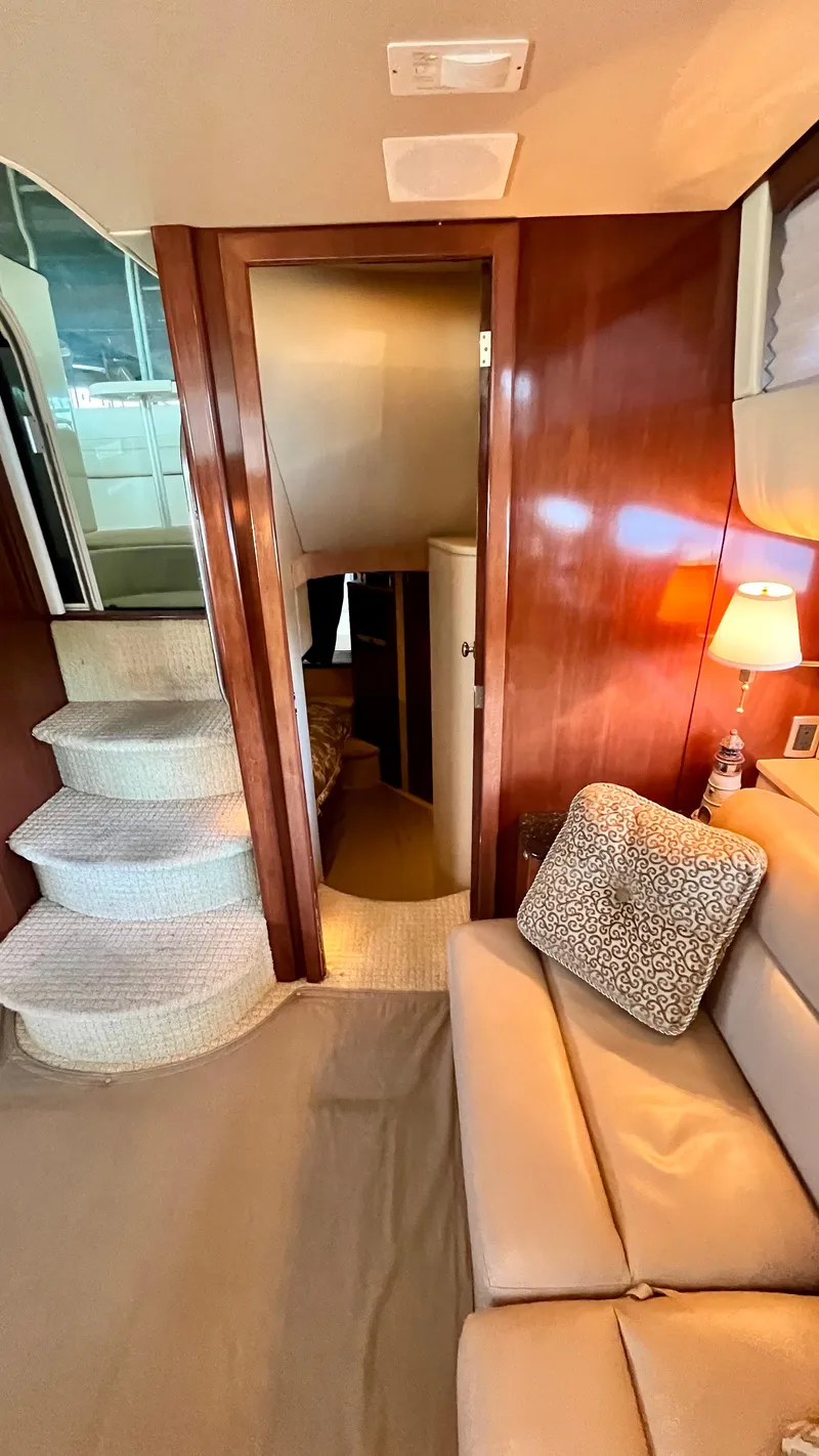 Slide: The Image of Interior of 2008 Meridian 459 Motoryacht with stairs, sofa, and cozy lighting. - 35