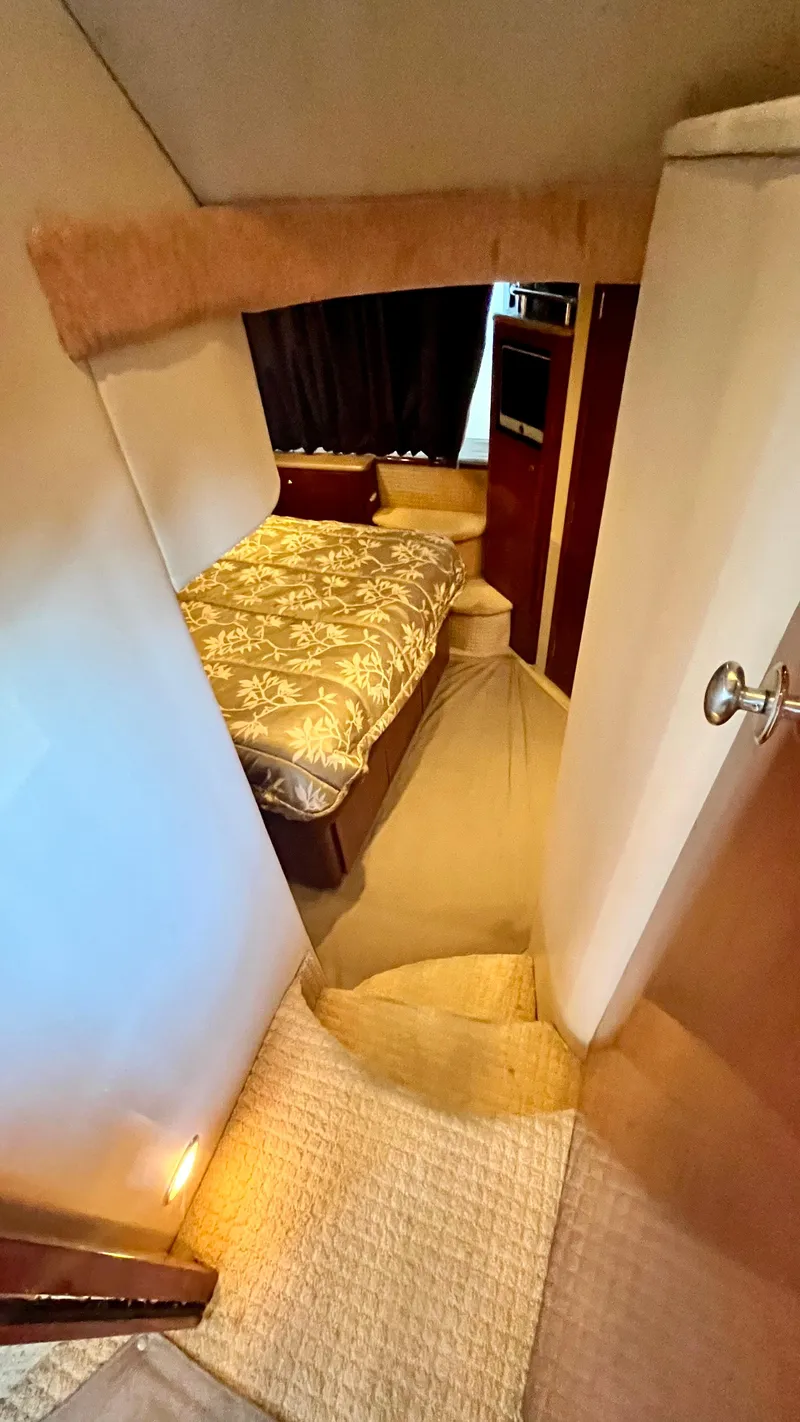 Slide: The Image of 2008 Meridian 459 Motoryacht interior cabin with bed and steps. - 36