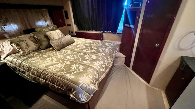 Slide: The Image of Luxurious bedroom in 2008 Meridian 459 Motoryacht with elegant bedding and wood accents. - 37