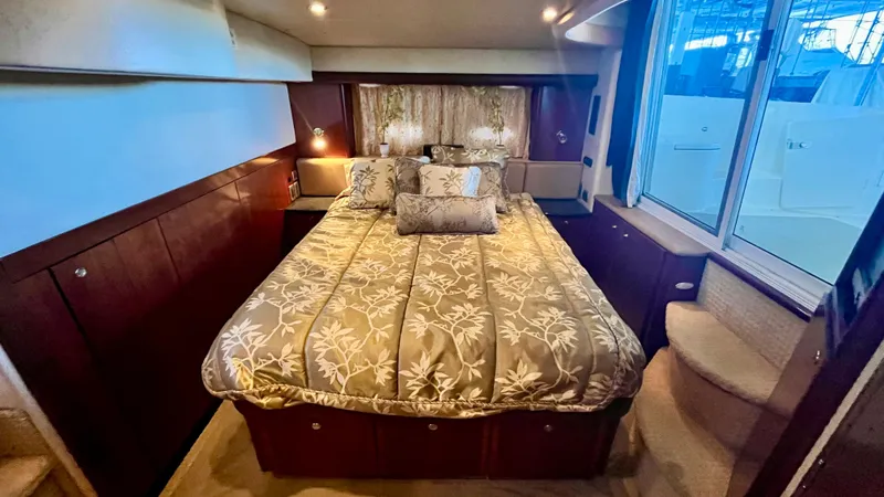 Slide: The Image of Luxurious bedroom in a 2008 Meridian 459 Motoryacht with elegant bedding and ample lighting. - 39