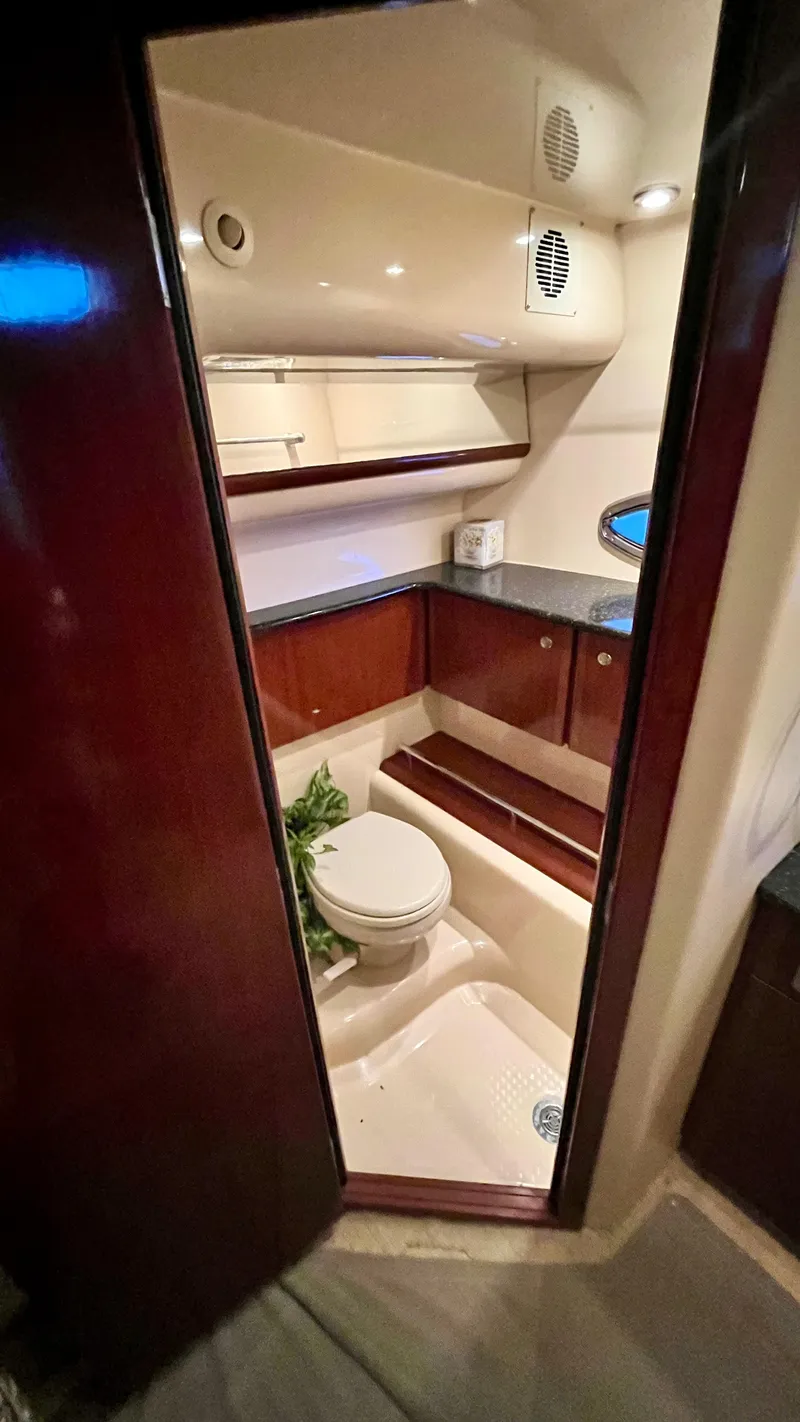 Slide: The Image of 2008 Meridian 459 Motoryacht bathroom with modern fixtures and wood accents. - 41