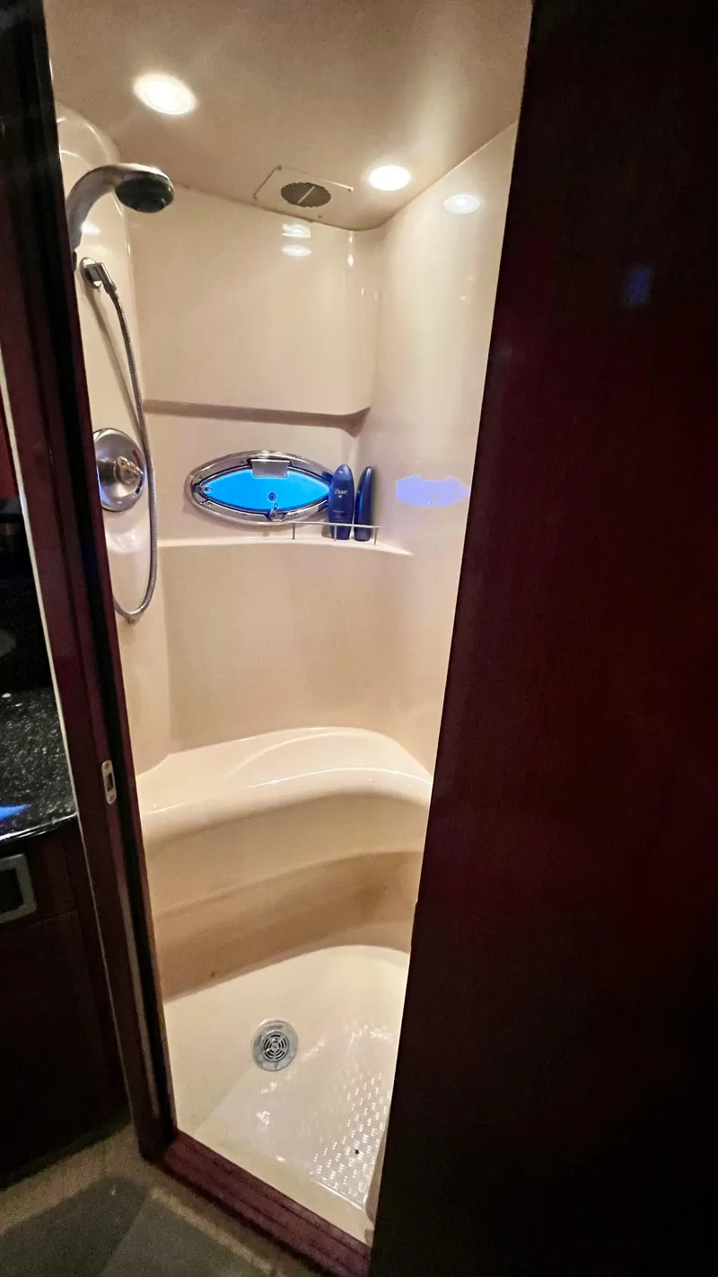 Slide: The Image of 2008 Meridian 459 Motoryacht bathroom with shower and porthole window. - 42