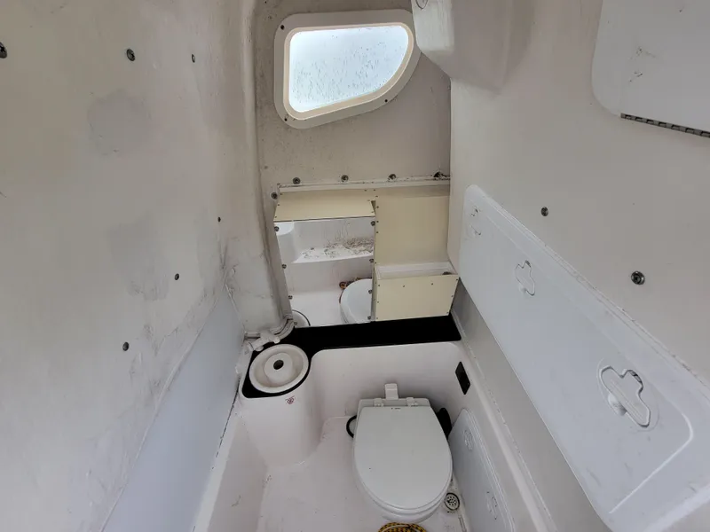 Slide: The Image of 2016 Sea Fox 266 Commander boat interior with toilet and window. - 14