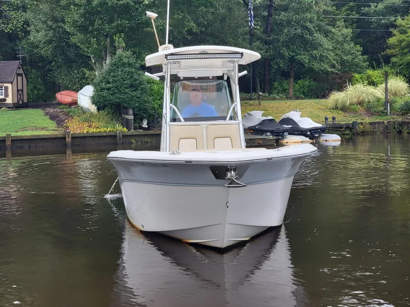 Slide: The Image of 2016 Sea Fox 266 Commander boat on a calm river near a wooded shoreline. - 7