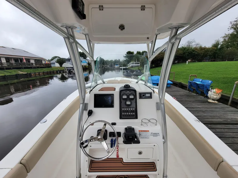 Slide: The Image of 2016 Sea Fox 266 Commander boat cockpit with steering wheel and control panel. - 8