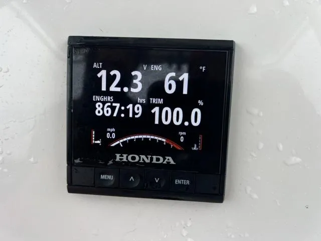 Slide: The Image of Honda engine display on 2020 Key West 239 FS boat showing various metrics. - 7